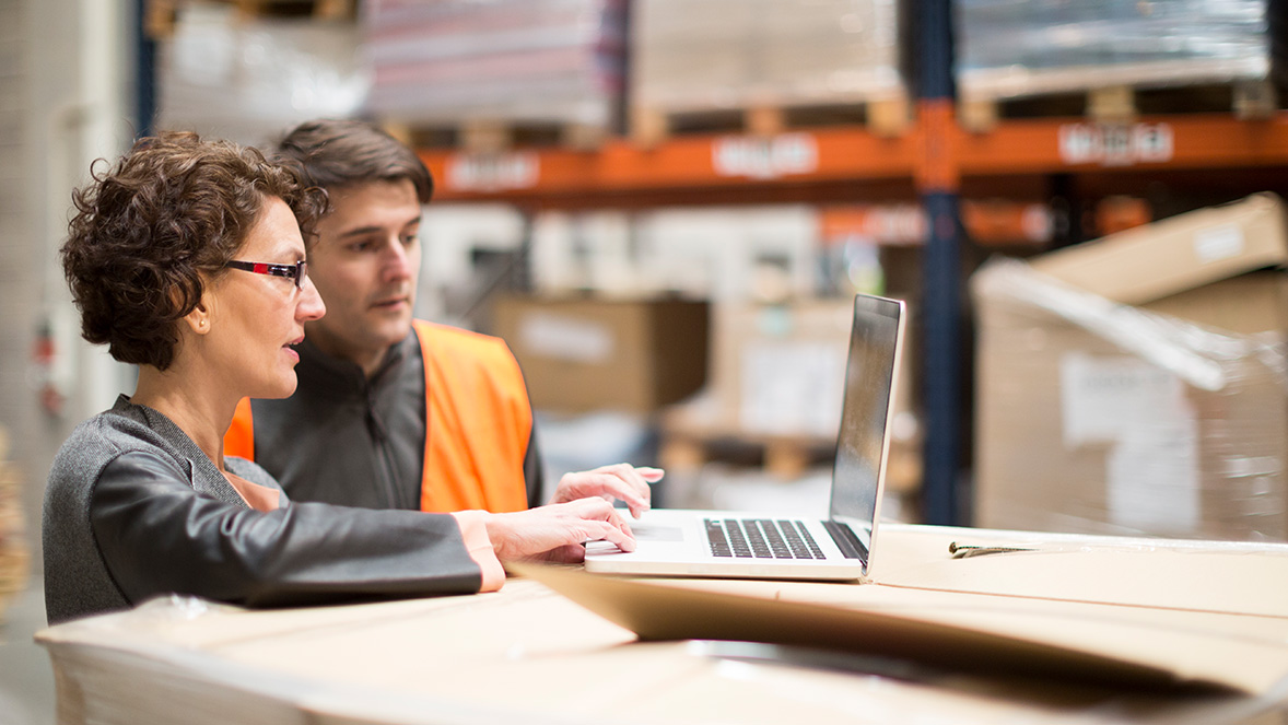 two colleagues working at a laptop